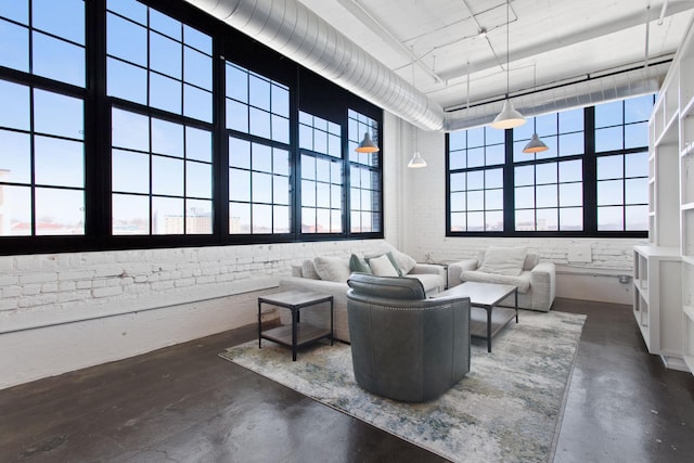 interior space featuring concrete floors and a high ceiling