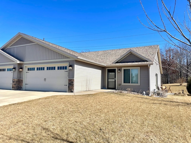 ranch-style house with a front yard, an attached garage, driveway, and roof with shingles