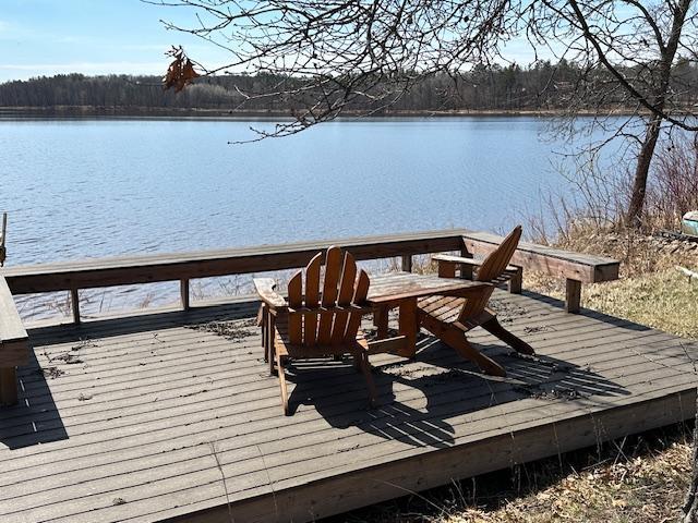 dock area with a deck with water view