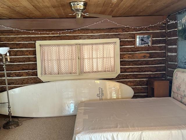 room details featuring wood ceiling and rustic walls