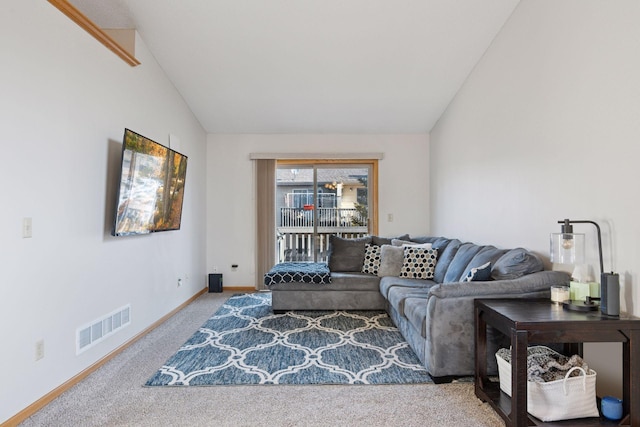 living area featuring vaulted ceiling, baseboards, visible vents, and carpet floors