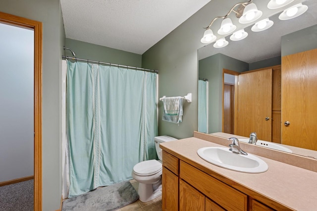 bathroom with vanity, a shower with curtain, tile patterned flooring, a textured ceiling, and toilet