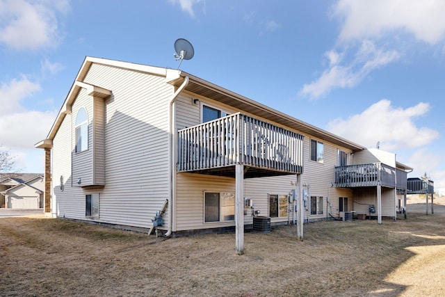 back of house with central AC