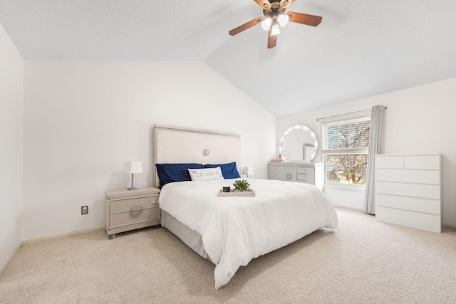 bedroom featuring light carpet, ceiling fan, and vaulted ceiling