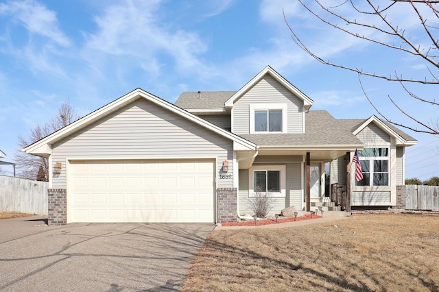 view of front of house featuring driveway, fence, roof with shingles, an attached garage, and brick siding