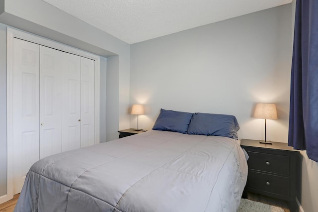 bedroom featuring a closet and a textured ceiling