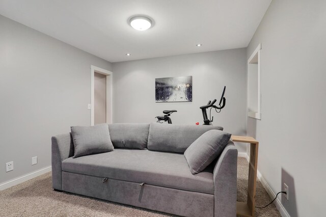 living area with carpet flooring, recessed lighting, and baseboards