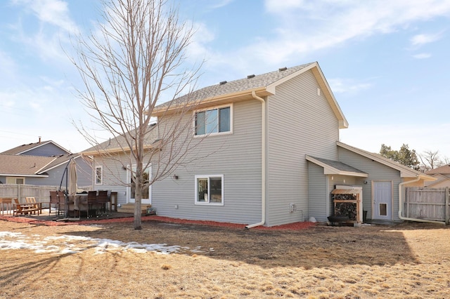 back of house featuring a patio area and fence