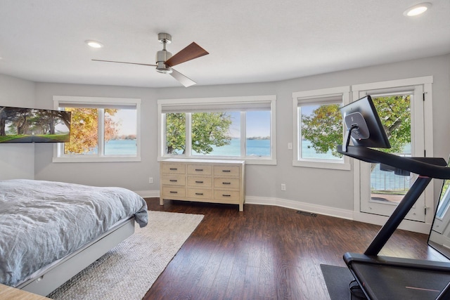 bedroom with visible vents, baseboards, dark wood finished floors, and recessed lighting