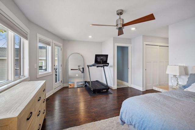 bedroom with dark wood-type flooring, recessed lighting, and baseboards