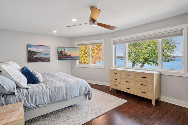 bedroom with dark wood-style floors, recessed lighting, baseboards, and a ceiling fan