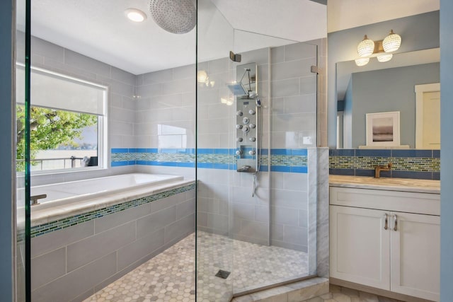 bathroom with tasteful backsplash, a garden tub, vanity, and a walk in shower