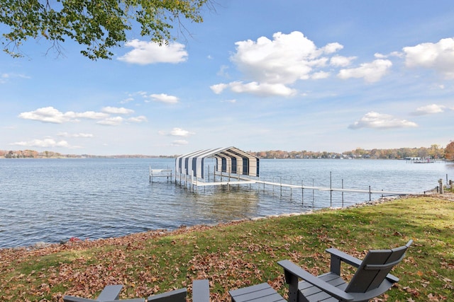 dock area with a water view and boat lift