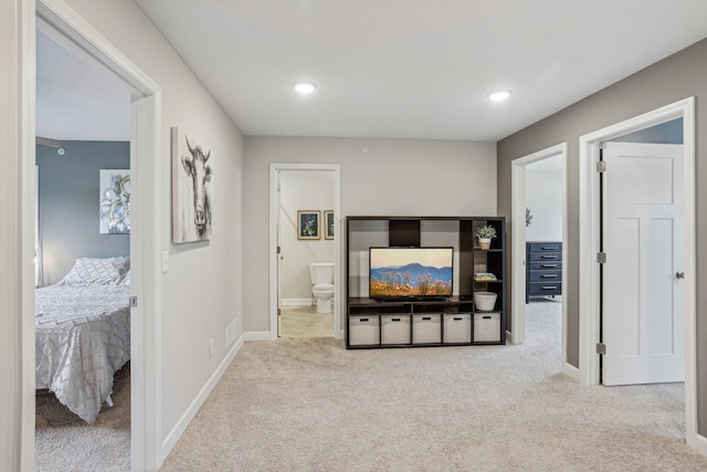 interior space featuring baseboards, connected bathroom, and recessed lighting