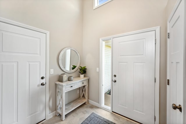 entrance foyer featuring baseboards