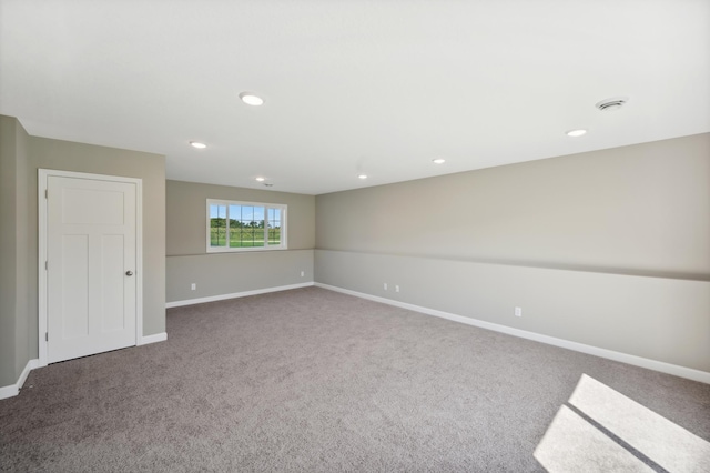 carpeted empty room with recessed lighting and baseboards