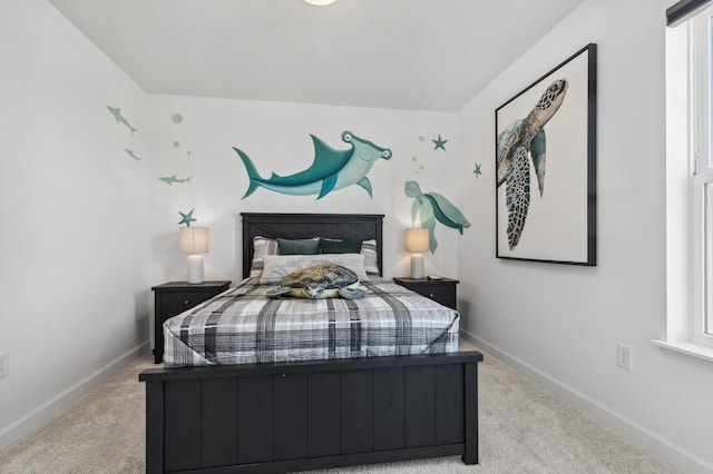 carpeted bedroom featuring baseboards