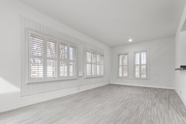 unfurnished living room featuring recessed lighting and carpet floors