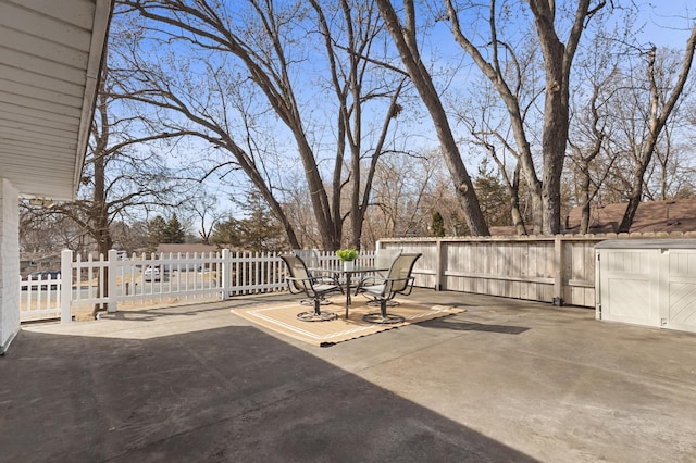 view of patio featuring fence