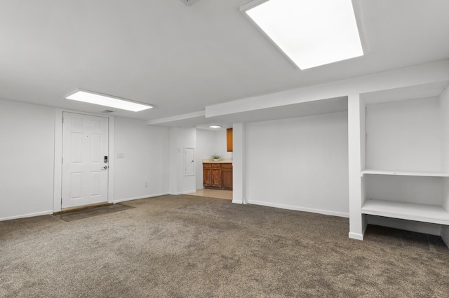 finished basement with baseboards and carpet