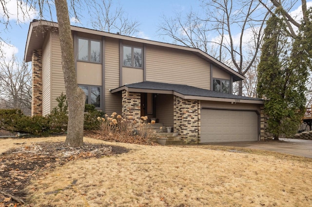 view of front facade featuring a garage, brick siding, and concrete driveway