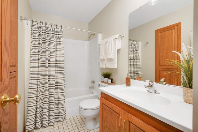 bathroom with toilet, a textured ceiling, shower / tub combo, tile patterned flooring, and vanity