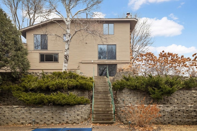 view of front of home featuring stairs