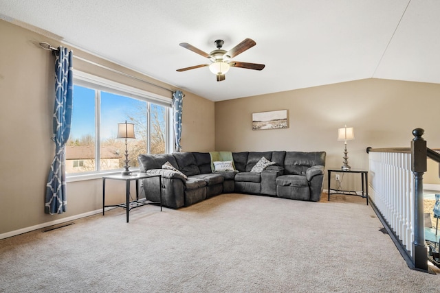 living area featuring visible vents, carpet floors, a ceiling fan, and vaulted ceiling