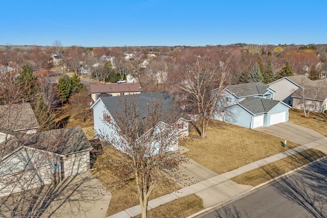 birds eye view of property with a residential view