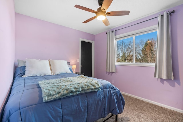 carpeted bedroom featuring a ceiling fan and baseboards