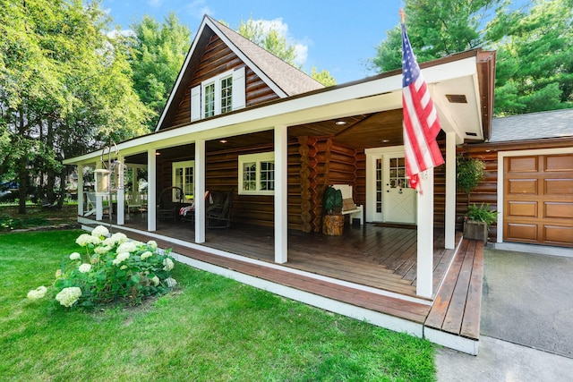 exterior space featuring a shingled roof, a lawn, and log exterior