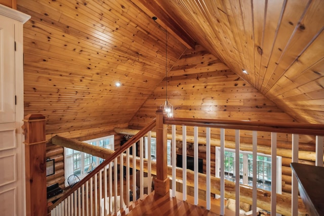 corridor featuring wooden ceiling, a healthy amount of sunlight, log walls, and wood finished floors