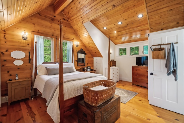 bedroom featuring light wood finished floors, recessed lighting, lofted ceiling with beams, wood ceiling, and wood walls