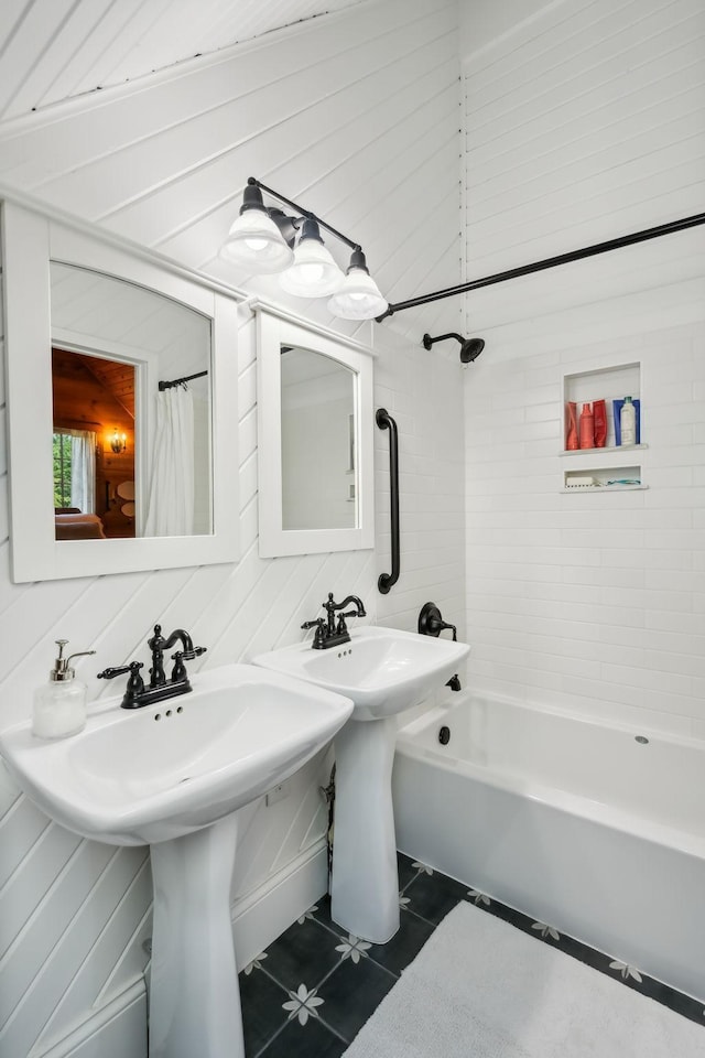 full bath with tile patterned flooring and shower / bath combo with shower curtain