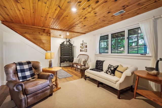 living area featuring wood ceiling, stairway, wood finished floors, and visible vents