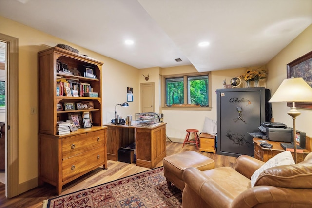 office space featuring recessed lighting, light wood-style flooring, and baseboards