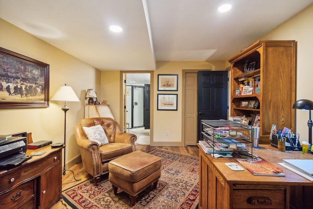 office area featuring baseboards, recessed lighting, and light wood-style floors