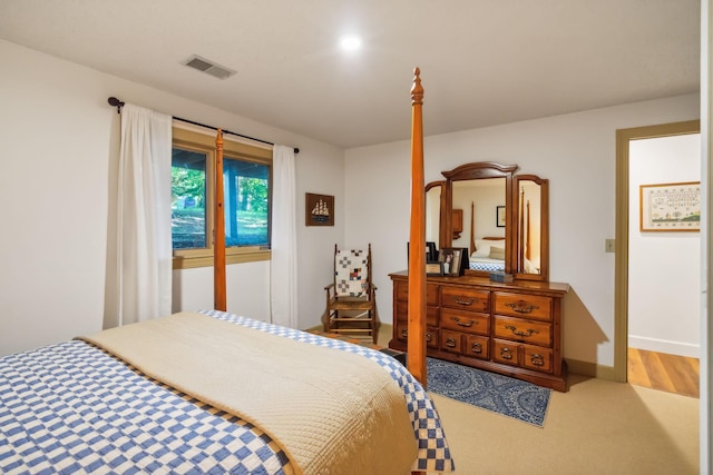 bedroom with baseboards and visible vents