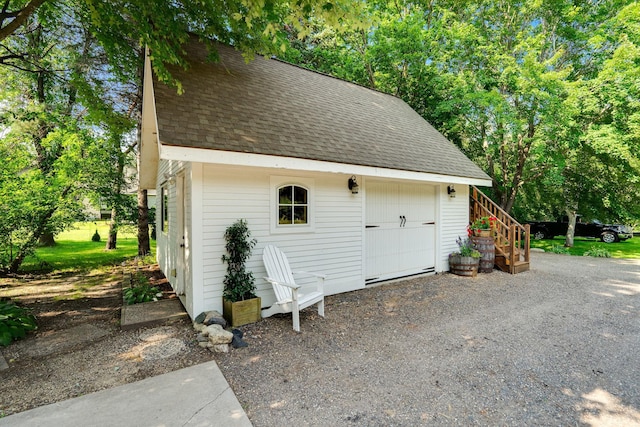 view of outbuilding featuring an outbuilding and gravel driveway