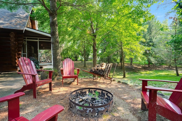 exterior space with an outdoor fire pit