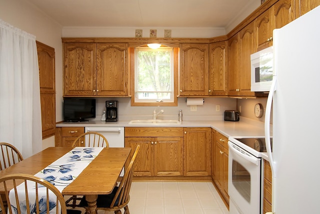 21 1st St NE, Fairfax, MN 55332 - kitchen with white appliances, brown cabinetry, light countertops, and crown molding