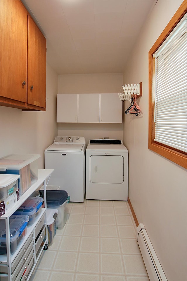 21 1st St NE, Fairfax, MN 55332 - laundry room featuring a baseboard heating unit, washer and dryer, cabinet space, and light floors