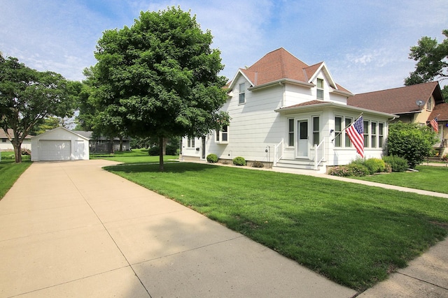 21 1st St NE, Fairfax, MN 55332 - view of front facade featuring entry steps, a detached garage, an outbuilding, and a front yard