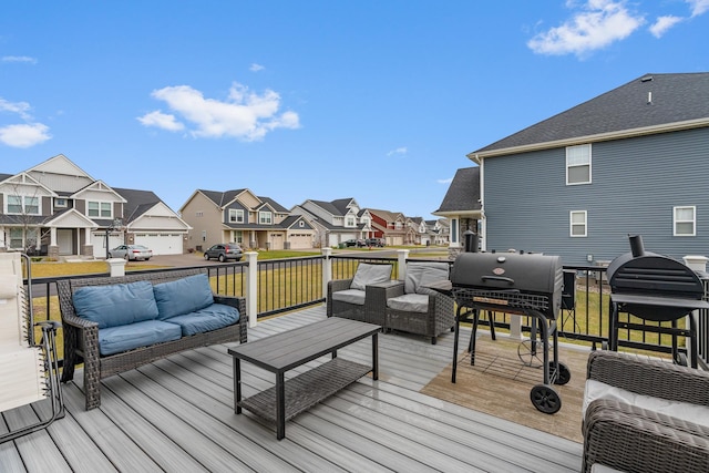 wooden terrace featuring a residential view, an outdoor living space, and area for grilling