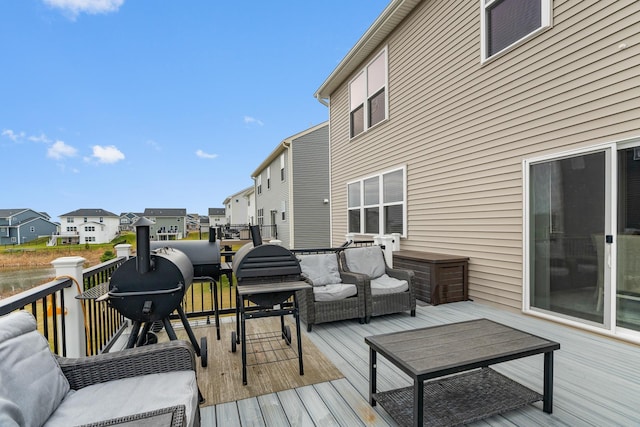 wooden deck featuring outdoor lounge area and a residential view