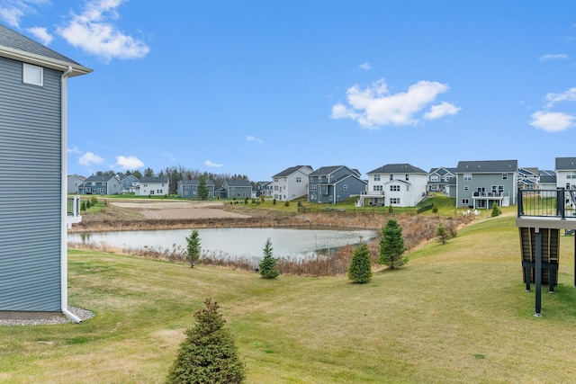 view of yard with a water view and a residential view