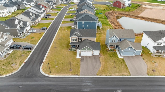 aerial view featuring a water view and a residential view