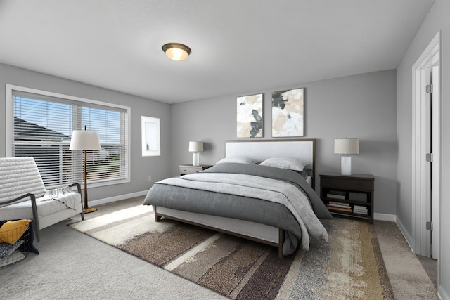 carpeted bedroom with baseboards