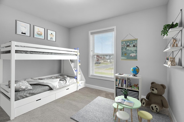 bedroom with carpet floors and baseboards