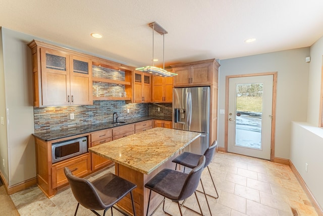 kitchen featuring a sink, open shelves, tasteful backsplash, and stainless steel appliances